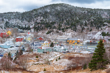 A small fishing village, Quidi Vidi Village, in Newfoundland. Colorful wooden houses surround a...