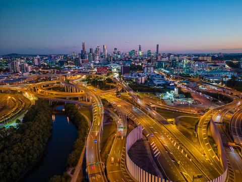 Fototapeta Aerial view of Brisbane city and highway traffic in Australia at night