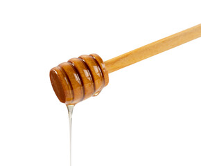 Honey and wooden honey dipper on white background.
