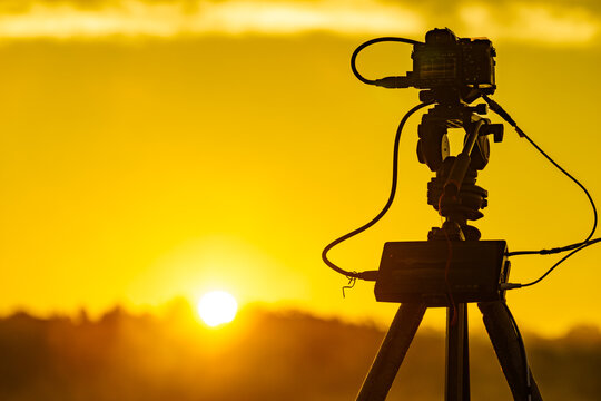 Camera taking picture of sunrise