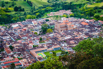Jerico Town Colombian Deparment of Antioquia Medellin Aerial Drone Fly Out of The Catholic Pueblo Urban Church Zone into Wilderness