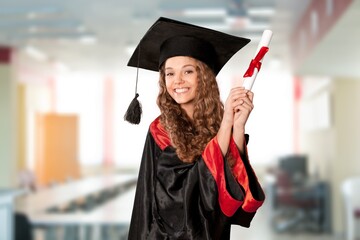 Pretty woman with graduate bechalor degree. Education successful university college woman smiling...