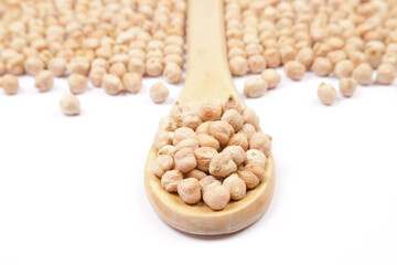 top view of spoon with chickpeas on white background