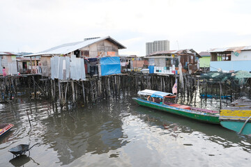 Fototapeta na wymiar A rustic stilt village of Kampung Tinosan in Sandakan during low tide time.