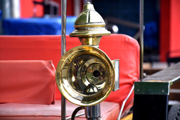 The shape of a wagon horn with a golden yellow color, which is a traditional transportation in...