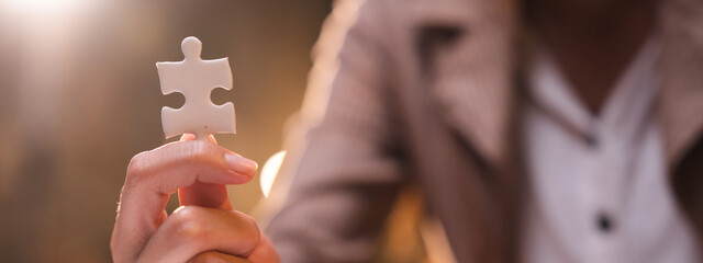 Concept of integration and startup with puzzle pieces merger with teamwork of business worker...