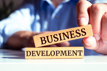 Wooden blocks with words 'Business development'. Business concept