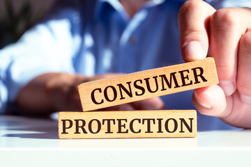 Wooden blocks with words 'CONSUMER PROTECTION'. Business concept