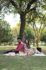 a couple doing fun in a park