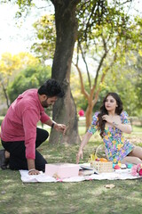 Fototapeta premium a couple wearing clothes doing fun a park