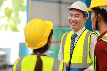 Group of technician engineer and businessman in protective uniform standing and discussing, researching, brainstorming and planning work together with protection mask at industry manufacturing factory