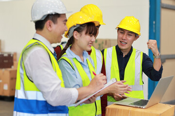 Group of technician engineer and businessman in protective uniform standing and discussing, researching, brainstorming and planning work with computer together at industry manufacturing factory