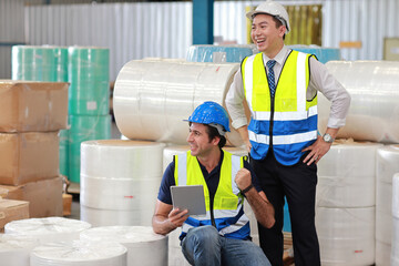 Group of technician engineer and businessman in protective uniform standing and discussing, researching, brainstorming and planning work together with tablet at industry manufacturing factory