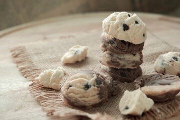 cookies stack on hemp sack above wooden table