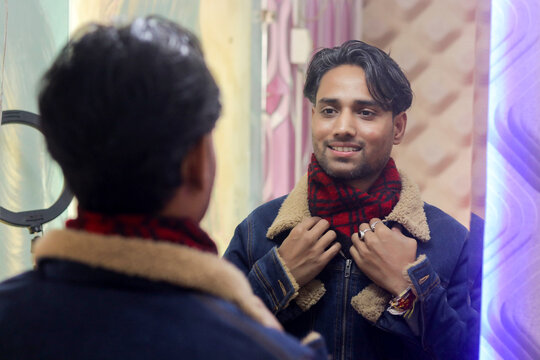 Indian photographer man with camera and mirror