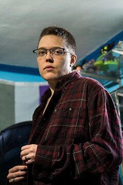 Portrait of young Brazilian transman indoor