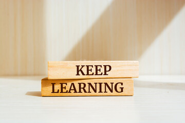 Wooden blocks with words 'keep learning'. Education concept