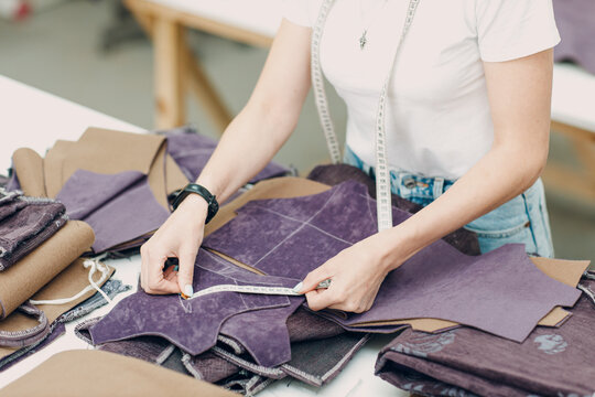 Tailor Measuring Purple Fabric