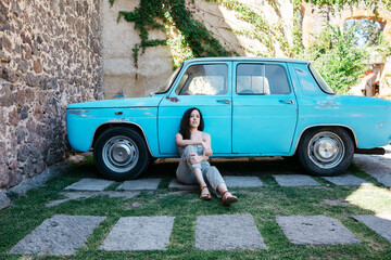 Woman in blue car