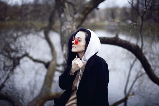 Woman in black coat wearing white hijab