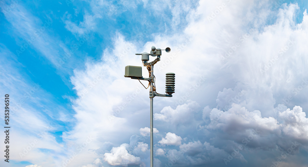 Wall mural Weather station automatic measurement of weather parameters with Stormy sky