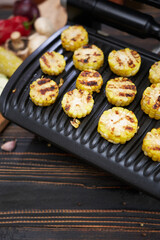 cooking at home on electric grill - sliced corn cobs