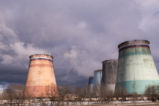 Large wide smoking chimneys. Picture of air pollution. Ecological catastrophy