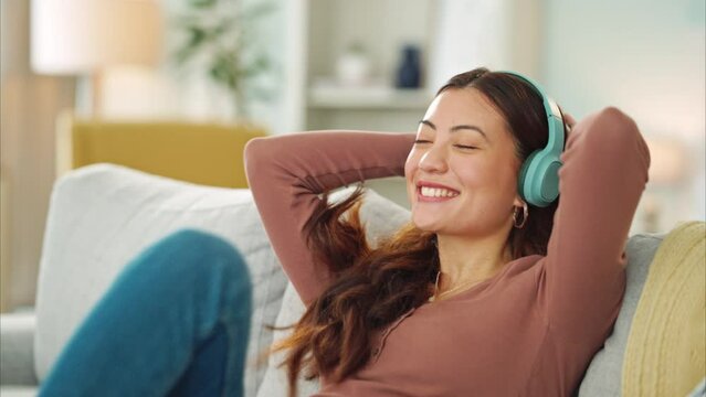 Woman, Phone Or Music Headphones On Relax Sofa In House Or Singapore Home Living Room. Smile, Enjoy Or Happy Student On Mobile Technology For Podcast, Dance Radio Or Audio Playlist App In Lockdown