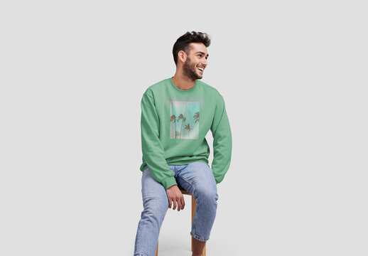 Man Sitting on Stool With a Sweatshirt Mockup