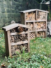 insect hotel, bug hotel, insect house, manmade structure created to provide shelter for insects. nesting facilities for insects