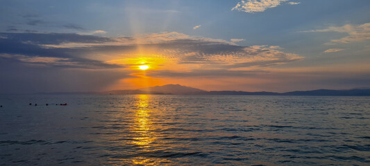 Sunset over Pakis beach on the Greek island of Thasos during a sunny summer day. © MoiraM