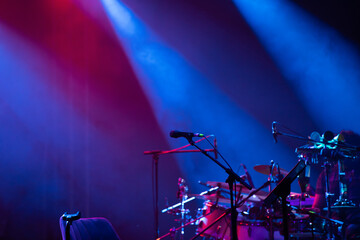 Colorful stage lights and microphone at concert