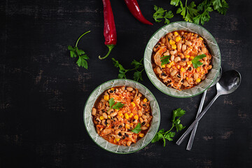 Chili con carne in bowl - traditional dish of mexican cuisine.Top view, flat lay