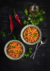 Chili con carne in bowl - traditional dish of mexican cuisine.Top view, flat lay