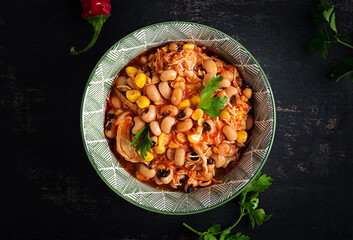 Chili con carne in bowl - traditional dish of mexican cuisine.Top view, flat lay