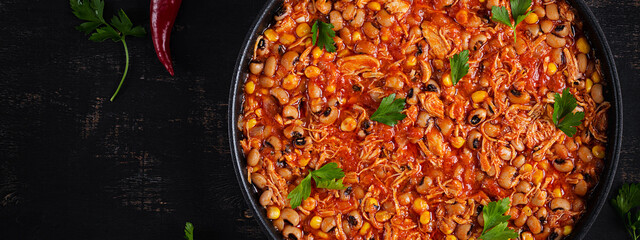 Chili con carne in bowl - traditional dish of mexican cuisine.Top view, banner