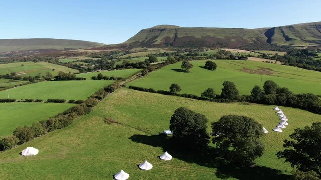 Aerial filming of luxury bell tents in Welsh Countryside.