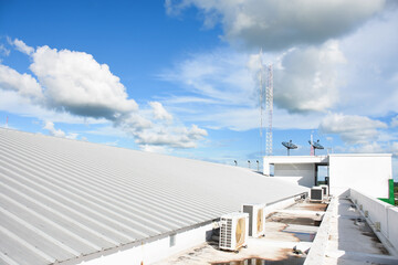 metal sheet roofing on commercial construction with blue sky
