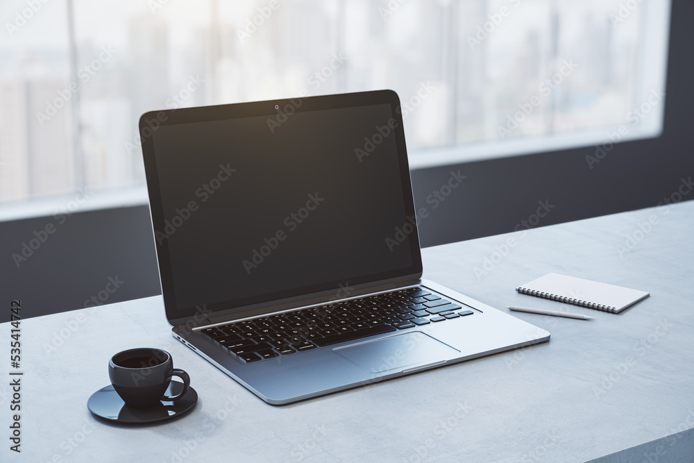 Poster close up of empty white laptop on wooden desktop with coffee cup, notepad, pen, mock up place on scr