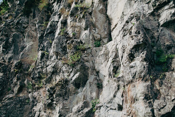 Fototapeta na wymiar Stone rocks on the mountain as background.