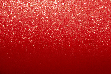 Shiny red background with blurred bokeh. Festive glitter gradient. Christmas, New Year, Birthday,...