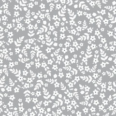 Simple vintage pattern. small white flowers and  leaves. grey background. Fashionable print for textiles and wallpaper.
