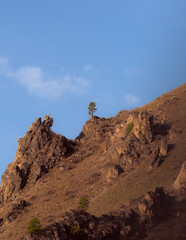 view of a person climbing up a mountain