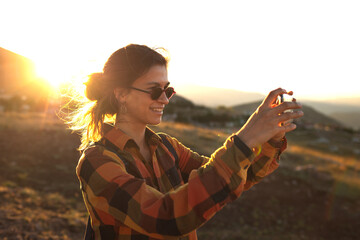 girl taking pictures on the phone