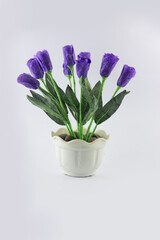 Indonesian home made imitation purple flower made from papper and plastic with pot