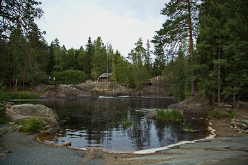 Log cabin on the bank of the river Tokhmajoki.