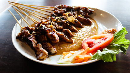 chicken satay with peanut sauce, 
indonesian skewer cuisine