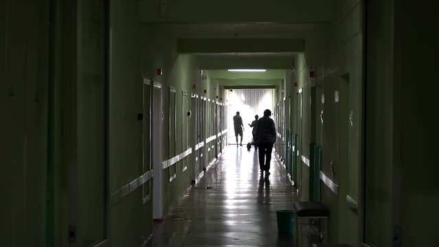 patients in silhouette  walking down a dark hospital corridor
Science, medicine, epidemic, coronavirus
Bright modern hospital with friendly staff