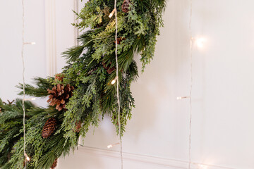 The area is decorated with a Christmas tree and garlands. New Year's room decor