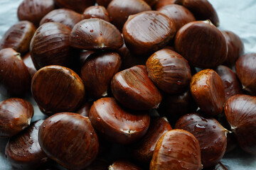 top view of chestnuts covered with water drops ready to be cooked   